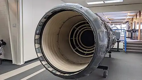 The afterburner was rated for continuous operation at 3,200&nbsp;°F (1,800&nbsp;°C) made possible with ceramic coatings (colored white) on duct liner and flame holders[87] and compressor bleed air cooling the duct and nozzle (above Mach 2.1 when the bleed was flowing). The nozzle is fully open, the maximum afterburning position. The main purpose of the variable nozzle area was to control engine operation which it did in conjunction with varying heat release in the afterburner.
