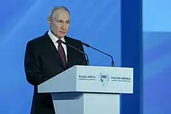 Putin speaking at the Russia-Africa parliamentary conference in Moscow on 20 March 2023. According to the Economist Intelligence Unit, two-thirds of the world's population live in countries that are neutral or leaning towards Russia.[169]