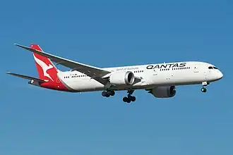 A Boeing 787-9 Dreamliner with Qantas livery in flight