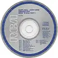 Standard "Blue Ring" RCA Victor label used on early US CDs from 1983 through 1987. Some later reissues of this label design change the ring and print color from blue to black.