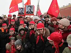 Party members lay down flowers at the tomb of Joseph Stalin