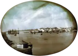 Photograph of various residential and commercial buildings along a waterfront