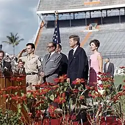 Artime saluting alongside President Kennedy