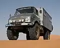 Unimog S404 used as mobile home in the Dunes of Erg Chebbi in Morocco. Note the high ground clearance due to portal gear axles
