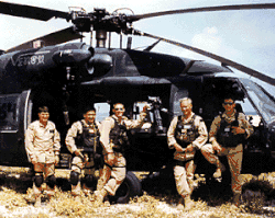 Soldiers in front of helicopter