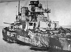 A black and white image of a heavily damaged German naval ship