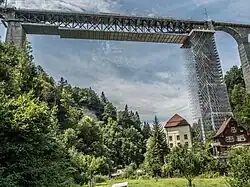 A tall bridge covered in temporary scaffolding