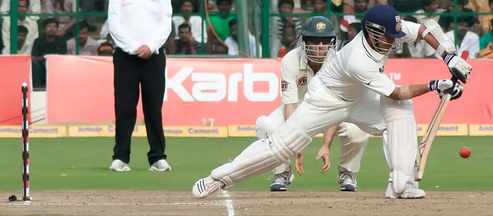 Indian cricket player Sachin Tendulkar, the highest run-getter in test cricket, playing a defensive stroke against Australia in Bangalore, 2010