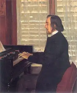 Man in top hat, smoking a cigarette, seated at a musical keyboard