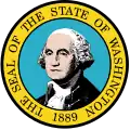 A circular seal with the words "The Seal of the State of Washington, 1889" centered around it from top to bottom. In the center, a man with gray hair poses.