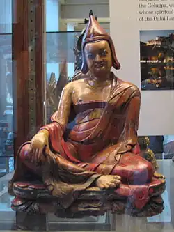 Room 33 – Figure of seated Lama; of painted and varnished papier-mâché, Ladakh, India, 19th century AD