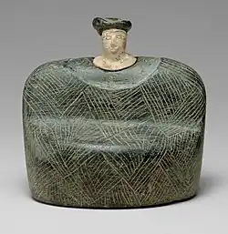 Seated figurine (Bactrian); 3rd-2nd millennia BC; chlorite and limestone; height: 9&nbsp;cm; Metropolitan Museum of Art (New York City)[84]