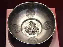 Lute player. Samanid (or Seljuk)[83] metal work, Khorezm, 10th century. Islamic Art Museum (Museum für Islamische Kunst), Berlin.[84]