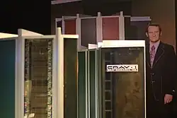 Cray behind a large computer