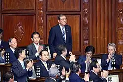 A political crisis began with Shigeru Ishiba is elected as Prime Minister of Japan by the National Diet, succeed Fumio Kishida and reelected in October 2024 following the election, he was resigned and replaced by Sanae Takaichi in a following year.