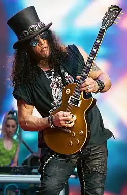 Slash playing guitar onstage