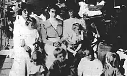 Black and white photograph of women and children