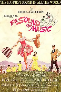 Poster with an illustration of actress Julie Andrews dancing in the mountains