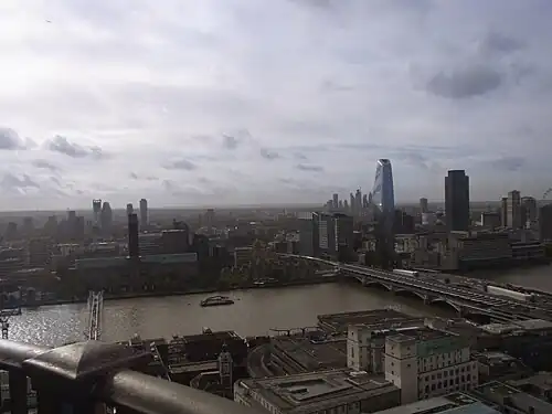 The emerging South Bank cluster as viewed from St Paul's Cathedral, October 2022. The two tallest towers here are One Blackfriars which was completed in 2018 at 163&nbsp;m and the South Bank Tower that was originally constructed in 1972 at 111&nbsp;m but was given an 11-storey height increase in 2017 to bring it up to 150&nbsp;m. There are several more towers planned for this cluster ranging from between 100&nbsp;m and 178.5&nbsp;m tall. There is also an emerging cluster at Elephant and Castle shown on the far left which includes notably, Strata SE1 and another emerging cluster in the distance on the right at Vauxhall/Nine Elms