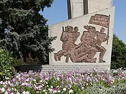 Soviet-era memorial with flower bed, Bender