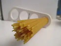 Spaghetti measured with a "spaghetti measure"The measure can portion out 1, 2, 3 or 4 servings based on the diameter of the circle.