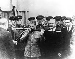 Joseph Stalin kisses the "Sword of Stalingrad" during the Tehran Conference, Iran, 1943. Valentin Berezhkov, Stalin's translator, second man on right side.