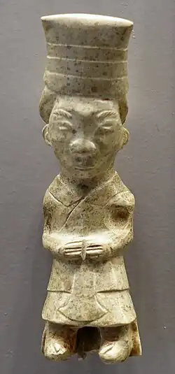 A standing dignitary wearing yichang and bixi, 12th century BCE