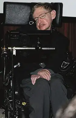 Stephen Hawking sitting in his wheelchair inside