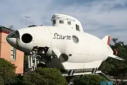 Star III submersible on display outside Scripps Institution of Oceanography. The white vessel has the appearance of a short, fat cigar.