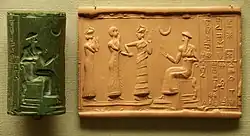 Cylinder seal showing a worshipper led by a protective goddess in front of a King seated on a throne (Ur-Namma?). British Museum.