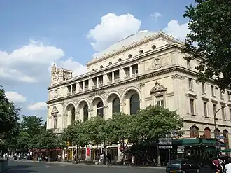 The Théâtre de la Ville, one of two matching theatres, designed by Gabriel Davioud, which Haussmann had constructed at the Place du Châtelet, the meeting point of his north–south and east–west boulevards.