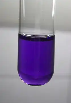Violet liquid in a test tube