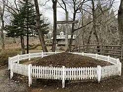 Grave hill marked with cross