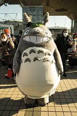 A cosplayer in a Totoro outfit
