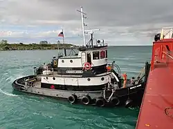 Tugboat Nancy Anne assisting a tug and barge docking in Rogers City, Michigan