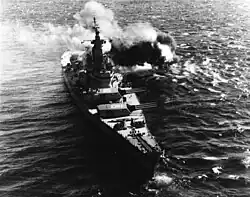 USS Iowa (BB-61) firing her 406 mm guns at North Korean coastal defenses in 1952.jpg