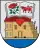 A coat of arms depicting an open book with a red rose on one page and a red bull on the other all hovering over a red heart with a building in the background