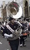 Photograph of a player marching with a sousaphone