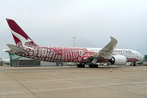 A Boeing 787–9 in 2018 wearing the Yam Dreaming livery, based on internationally renowned artist Emily Kame Kngwarreye's 1991 painting 'Yam Dreaming'. The aircraft has carried the colour scheme since 2018.
