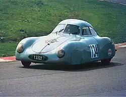 Blue sports racing car on the Nürburgring track in 1981.