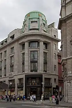 Art Deco reinterpretation of the Doric columns, with no flutings and with little or no entasis, on the Westmorland House (Regent Street no. 117–131), London, by Burnet & Tait, 1920-1925[32]