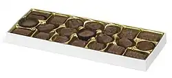 white box with about 20 bite-sized chocolate candies in it