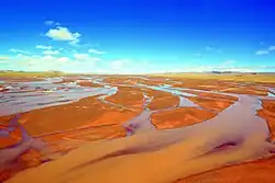 The Tuotuo River, a headwater stream of the Yangtze River, known in Tibetan as Maqu, or the "Red River"