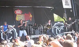 Yellowcard performing on Warped Tour 2012 (L–R: Josh Portman, Sean Mackin, Longineu Parsons III, Ryan Key and Ryan Mendez)