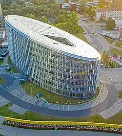 Aerial view of a modern, oval building